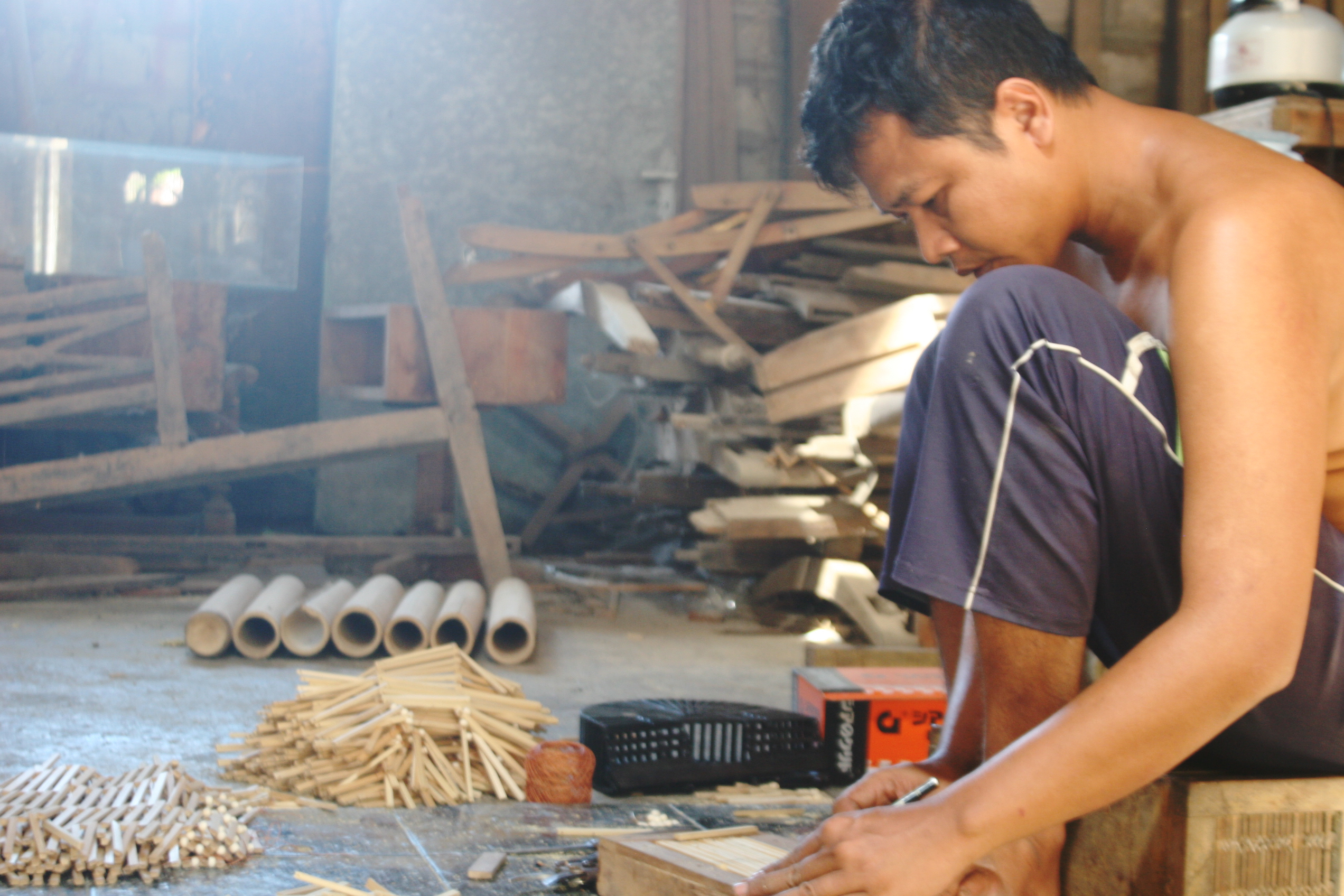 Artisan Measuring Adjusting Bamboo Sticks