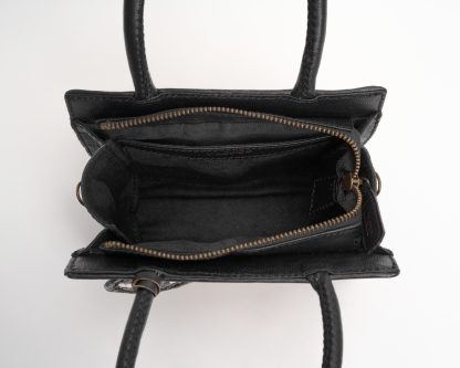 Nagini handbag black and dark shades inside