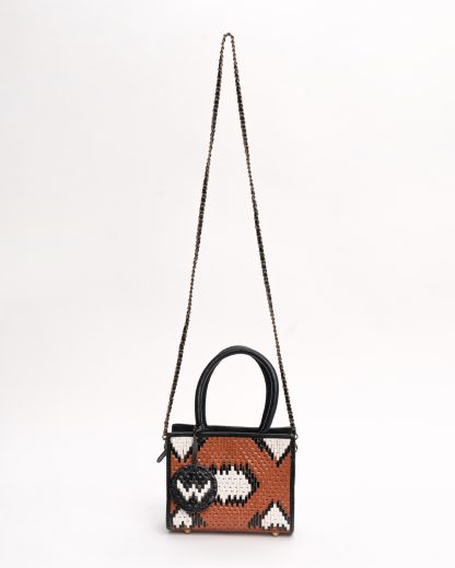 Nagini handbag black and dark shades front with a strap handwoven