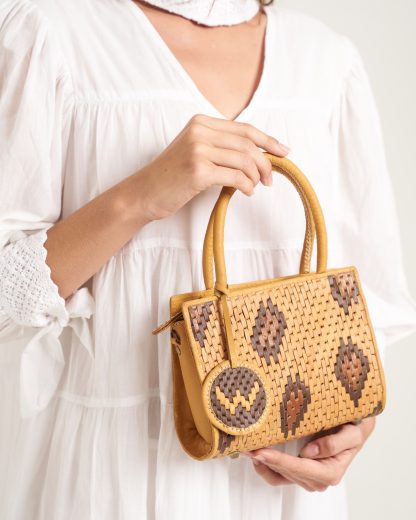 Wildindo leather handwoven handbag in tan with model