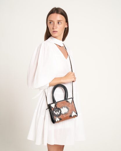 white dress with black bag